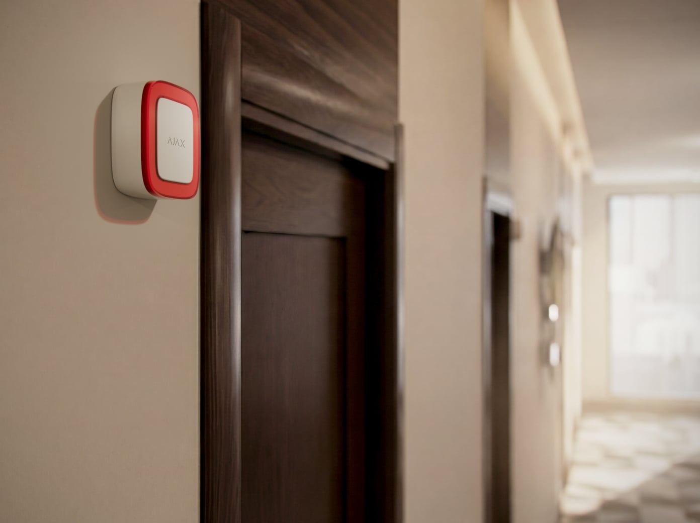 In a hotel corridor near room doors